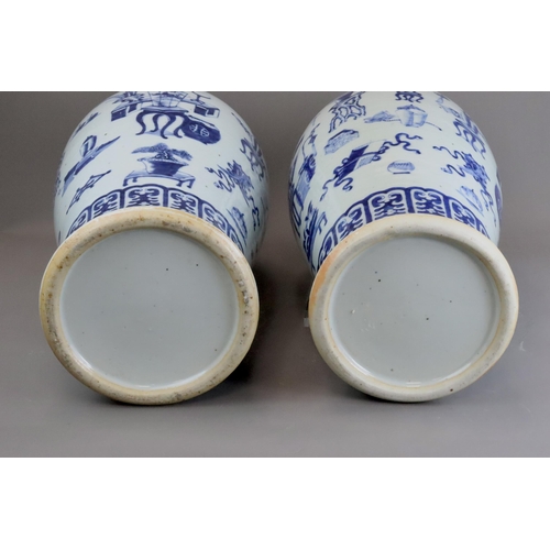 129 - A Large Pair of Blue and White 'Hundred Antiques' Vases, 19th century, Each tall baluster body decor... 