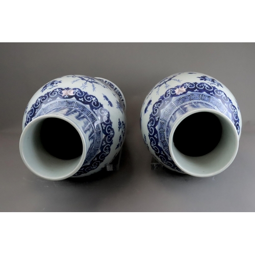 129 - A Large Pair of Blue and White 'Hundred Antiques' Vases, 19th century, Each tall baluster body decor... 