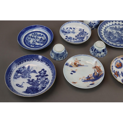 139 - A Set of 14 Saucers and 6 Cups, Kangxi and later 9 saucers with landscapes painted in blue and white... 