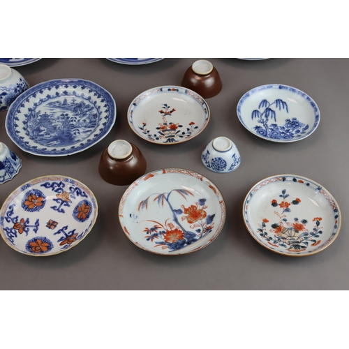 139 - A Set of 14 Saucers and 6 Cups, Kangxi and later 9 saucers with landscapes painted in blue and white... 