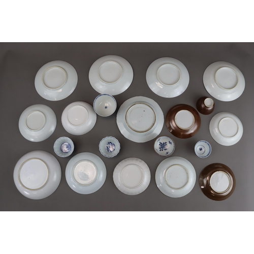 139 - A Set of 14 Saucers and 6 Cups, Kangxi and later 9 saucers with landscapes painted in blue and white... 