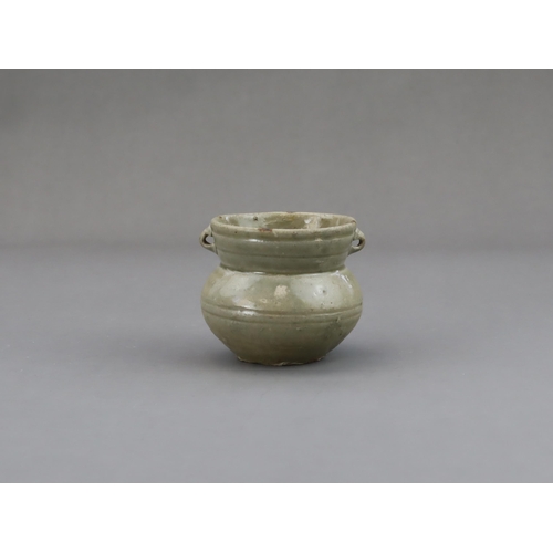 15 - A Yue Celadon-glazed Jar, Eastern Jin dynasty the tapered ovoid body rising to a splayed neck, two b... 