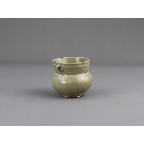 15 - A Yue Celadon-glazed Jar, Eastern Jin dynasty the tapered ovoid body rising to a splayed neck, two b... 