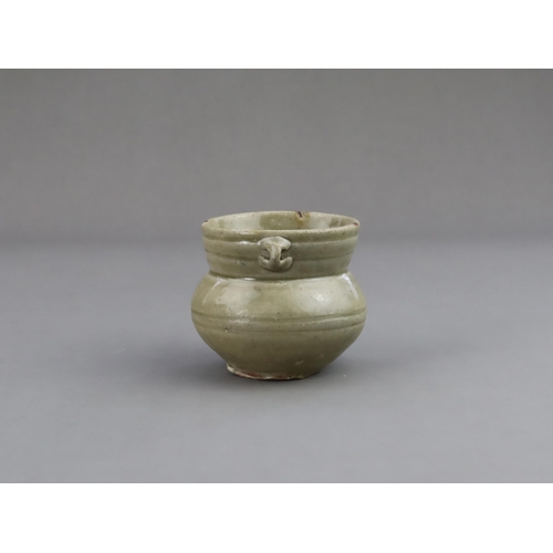 15 - A Yue Celadon-glazed Jar, Eastern Jin dynasty the tapered ovoid body rising to a splayed neck, two b... 