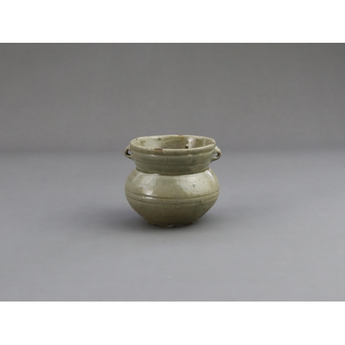 15 - A Yue Celadon-glazed Jar, Eastern Jin dynasty the tapered ovoid body rising to a splayed neck, two b... 