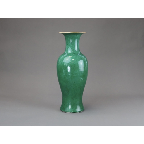 164 - An Apple Green Vase, Qing dynasty, of slender baluster form with waisted neck flaring to the mouth, ... 