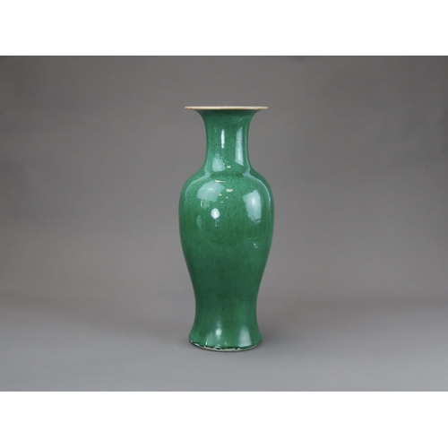 164 - An Apple Green Vase, Qing dynasty, of slender baluster form with waisted neck flaring to the mouth, ... 