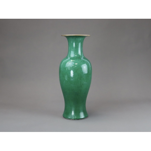 164 - An Apple Green Vase, Qing dynasty, of slender baluster form with waisted neck flaring to the mouth, ... 