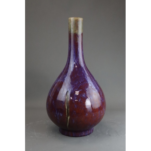 171 - A Flambe Bottle Vase, Qing dynasty the pear-shaped body rising from a straight foot to a slightly ta... 