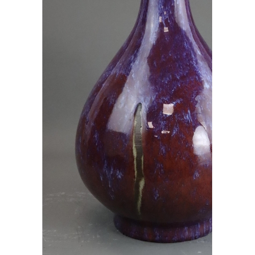 171 - A Flambe Bottle Vase, Qing dynasty the pear-shaped body rising from a straight foot to a slightly ta... 