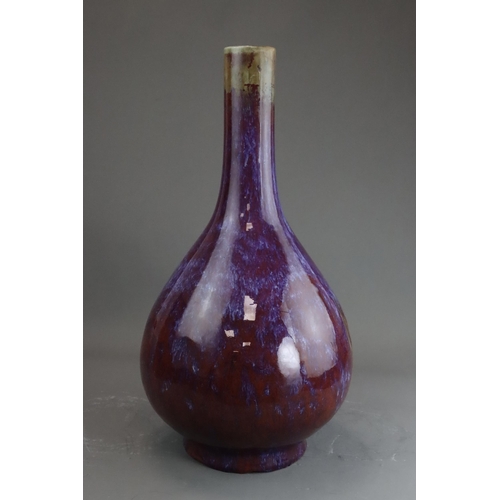 171 - A Flambe Bottle Vase, Qing dynasty the pear-shaped body rising from a straight foot to a slightly ta... 