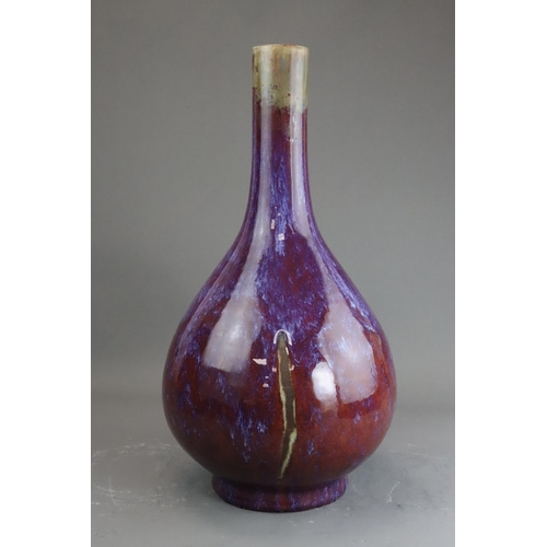 171 - A Flambe Bottle Vase, Qing dynasty the pear-shaped body rising from a straight foot to a slightly ta... 