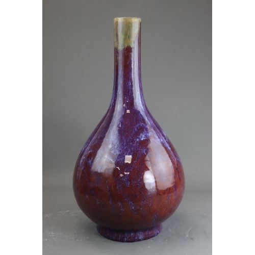 171 - A Flambe Bottle Vase, Qing dynasty the pear-shaped body rising from a straight foot to a slightly ta... 