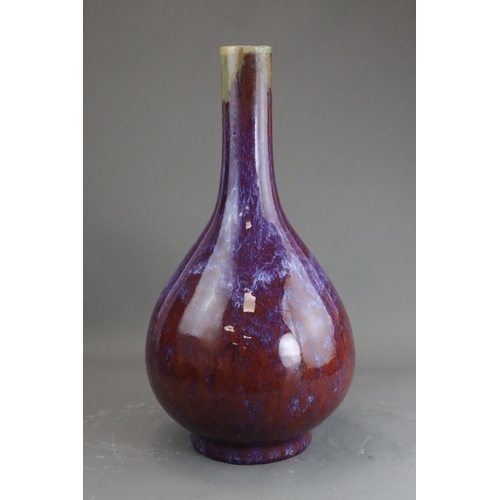 171 - A Flambe Bottle Vase, Qing dynasty the pear-shaped body rising from a straight foot to a slightly ta... 