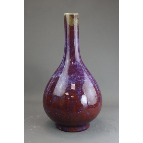 171 - A Flambe Bottle Vase, Qing dynasty the pear-shaped body rising from a straight foot to a slightly ta... 