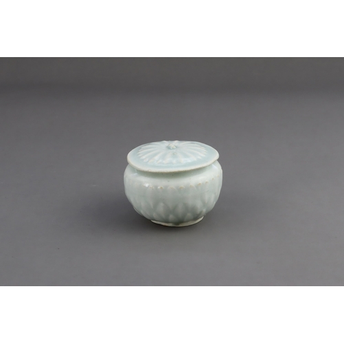 18 - A Qingbai Lotus Jar and Cover, Song dynasty the finely potted globular jar with three layers of carv... 