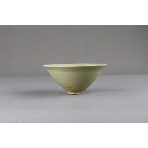 25 - A Fine Yaozhou Celadon Conical Bowl, Song dynasty of conical shape, thinly-potted from the short str... 