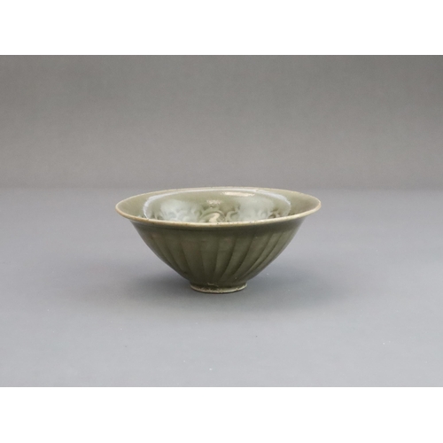 26 - A Yaozhou Moulded Chrysanthemum Conical Bowl, Song dynasty,  of conical shape from the short straigh... 