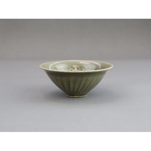 26 - A Yaozhou Moulded Chrysanthemum Conical Bowl, Song dynasty,  of conical shape from the short straigh... 