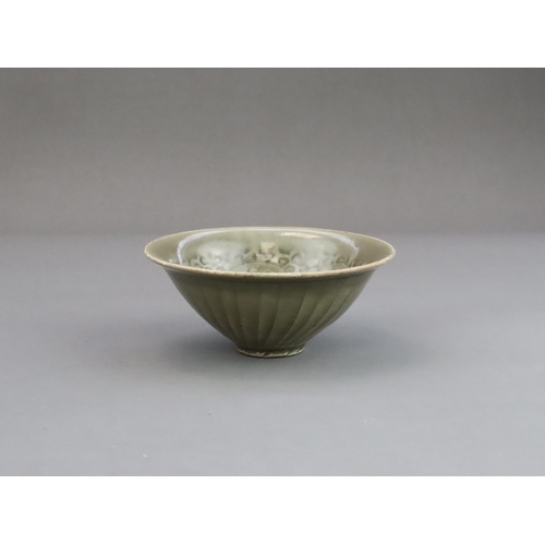 26 - A Yaozhou Moulded Chrysanthemum Conical Bowl, Song dynasty,  of conical shape from the short straigh... 