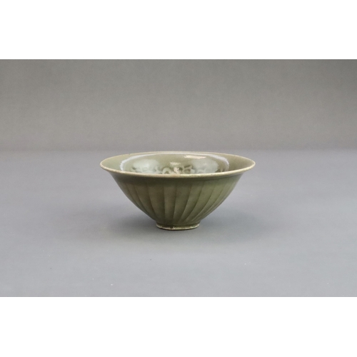 26 - A Yaozhou Moulded Chrysanthemum Conical Bowl, Song dynasty,  of conical shape from the short straigh... 