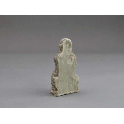 29 - A Rare Miniature Yaozhou Celadon-glazed Figure of a Monk, Song dynasty  The figure wearing long robe... 