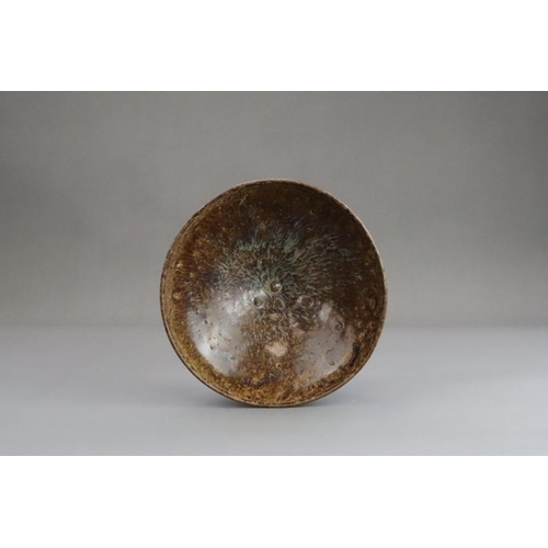 31 - A Jizhou Phosphatic-glazed Bowl, Song dynasty with flared sides rising to a rounded incurved rim, at... 