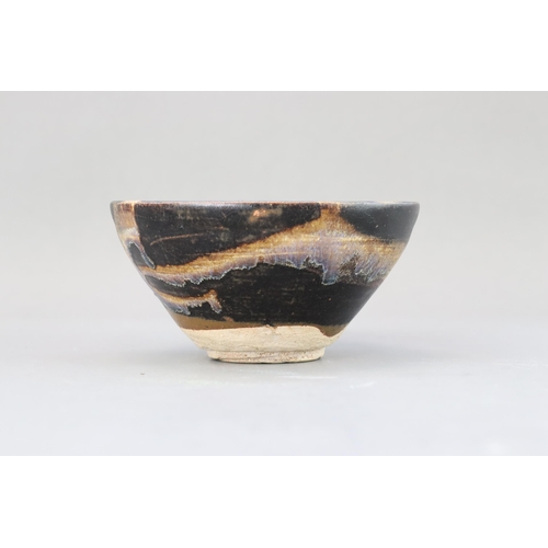 32 - A Jizhou Phosphatic-splash Bowl, Song dynasty of conical form with incurved mouth, overall in black ... 