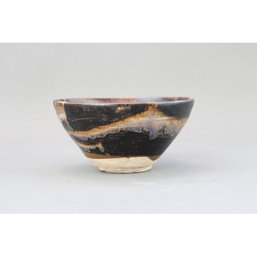 32 - A Jizhou Phosphatic-splash Bowl, Song dynasty of conical form with incurved mouth, overall in black ... 