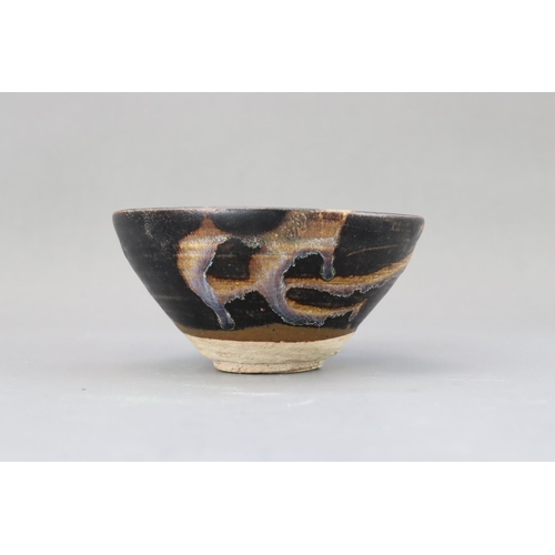 32 - A Jizhou Phosphatic-splash Bowl, Song dynasty of conical form with incurved mouth, overall in black ... 