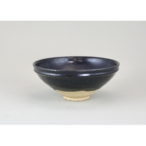 34 - A black-glazed 'oil-spot' bowl, Yuan dynasty finely potted with a circular body and steep side from ... 