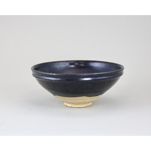 34 - A black-glazed 'oil-spot' bowl, Yuan dynasty finely potted with a circular body and steep side from ... 