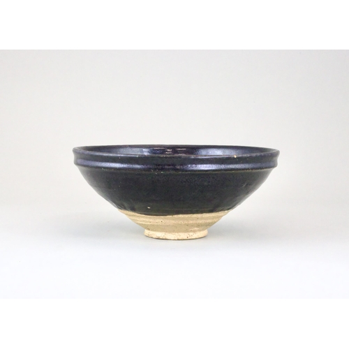 34 - A black-glazed 'oil-spot' bowl, Yuan dynasty finely potted with a circular body and steep side from ... 