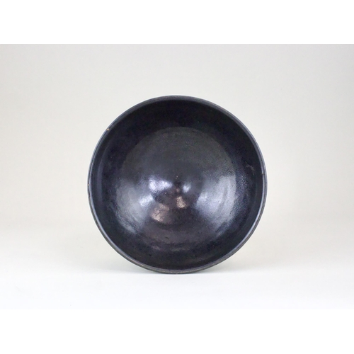 34 - A black-glazed 'oil-spot' bowl, Yuan dynasty finely potted with a circular body and steep side from ... 