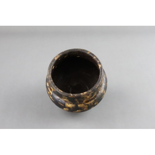 35 - A Jizhou Tortoiseshell Jar, Song dynasty the compressed ovoid body supported on a narrow foot, swell... 