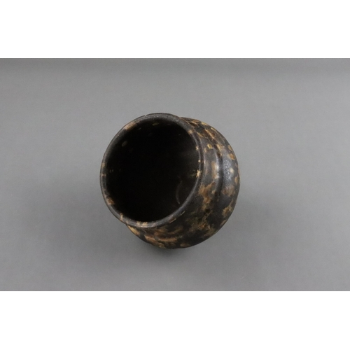 35 - A Jizhou Tortoiseshell Jar, Song dynasty the compressed ovoid body supported on a narrow foot, swell... 