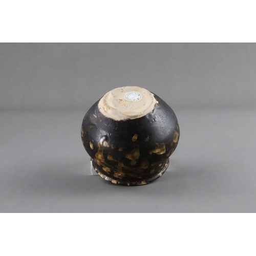 35 - A Jizhou Tortoiseshell Jar, Song dynasty the compressed ovoid body supported on a narrow foot, swell... 