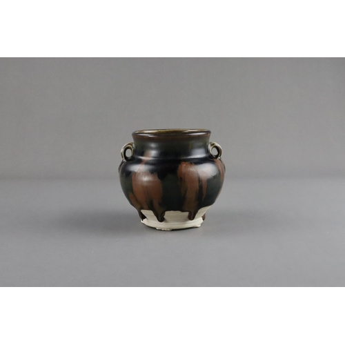 38 - A Cizhou Russet-splashed Black-glazed Handled Jar, Song dynasty the ovoid vessel with bulging should... 