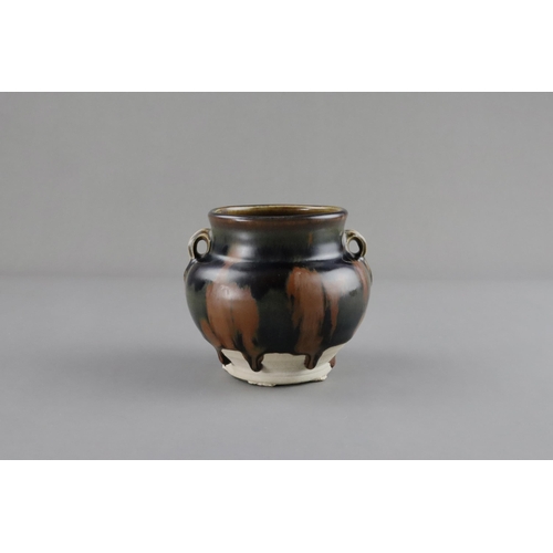 38 - A Cizhou Russet-splashed Black-glazed Handled Jar, Song dynasty the ovoid vessel with bulging should... 