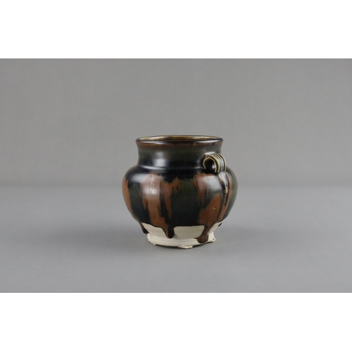 38 - A Cizhou Russet-splashed Black-glazed Handled Jar, Song dynasty the ovoid vessel with bulging should... 