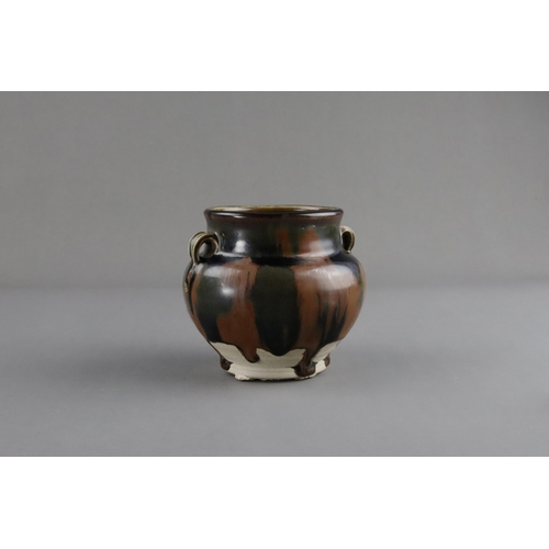 38 - A Cizhou Russet-splashed Black-glazed Handled Jar, Song dynasty the ovoid vessel with bulging should... 