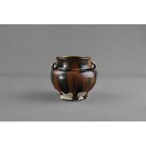 38 - A Cizhou Russet-splashed Black-glazed Handled Jar, Song dynasty the ovoid vessel with bulging should... 