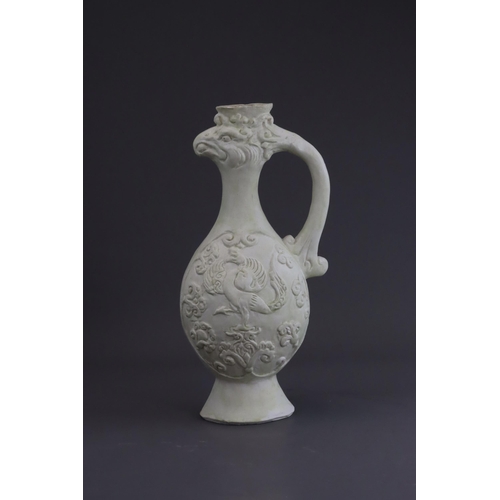 4 - A White-glazed 'Phoenix and Equestrian' Ewer, probably Tang dynasty the finely potted body of ovoid ... 