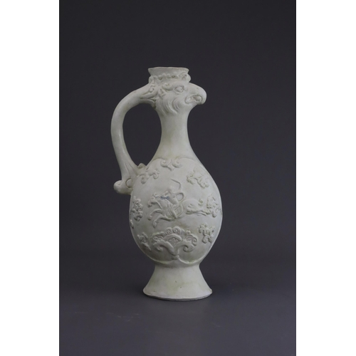 4 - A White-glazed 'Phoenix and Equestrian' Ewer, probably Tang dynasty the finely potted body of ovoid ... 