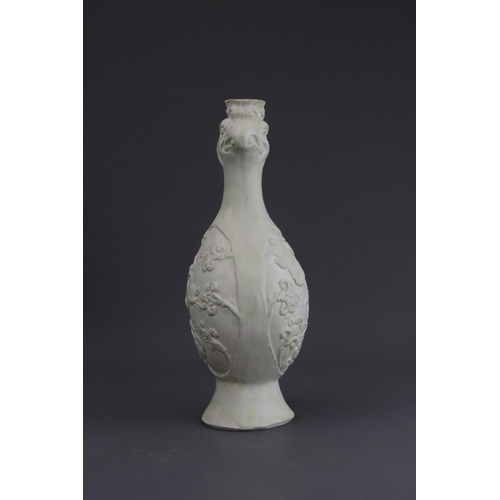 4 - A White-glazed 'Phoenix and Equestrian' Ewer, probably Tang dynasty the finely potted body of ovoid ... 