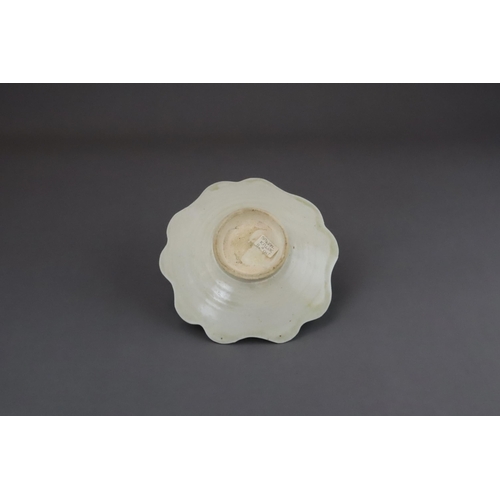 43 - An Extremely Rare Ding-type Lotus-form Cupstand, Five dynasties finely potted, the curved sides of t... 