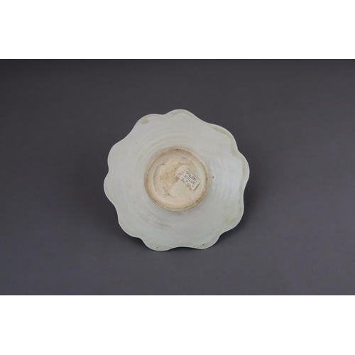 43 - An Extremely Rare Ding-type Lotus-form Cupstand, Five dynasties finely potted, the curved sides of t... 