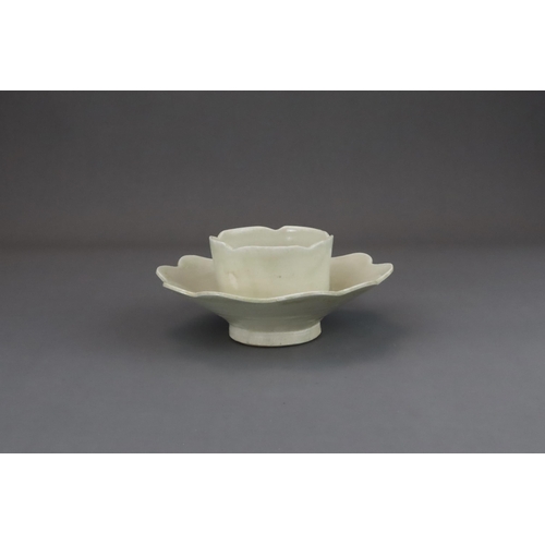 43 - An Extremely Rare Ding-type Lotus-form Cupstand, Five dynasties finely potted, the curved sides of t... 