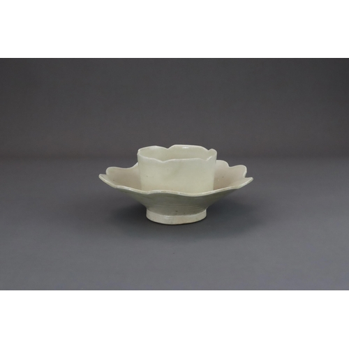 43 - An Extremely Rare Ding-type Lotus-form Cupstand, Five dynasties finely potted, the curved sides of t... 