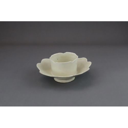 43 - An Extremely Rare Ding-type Lotus-form Cupstand, Five dynasties finely potted, the curved sides of t... 